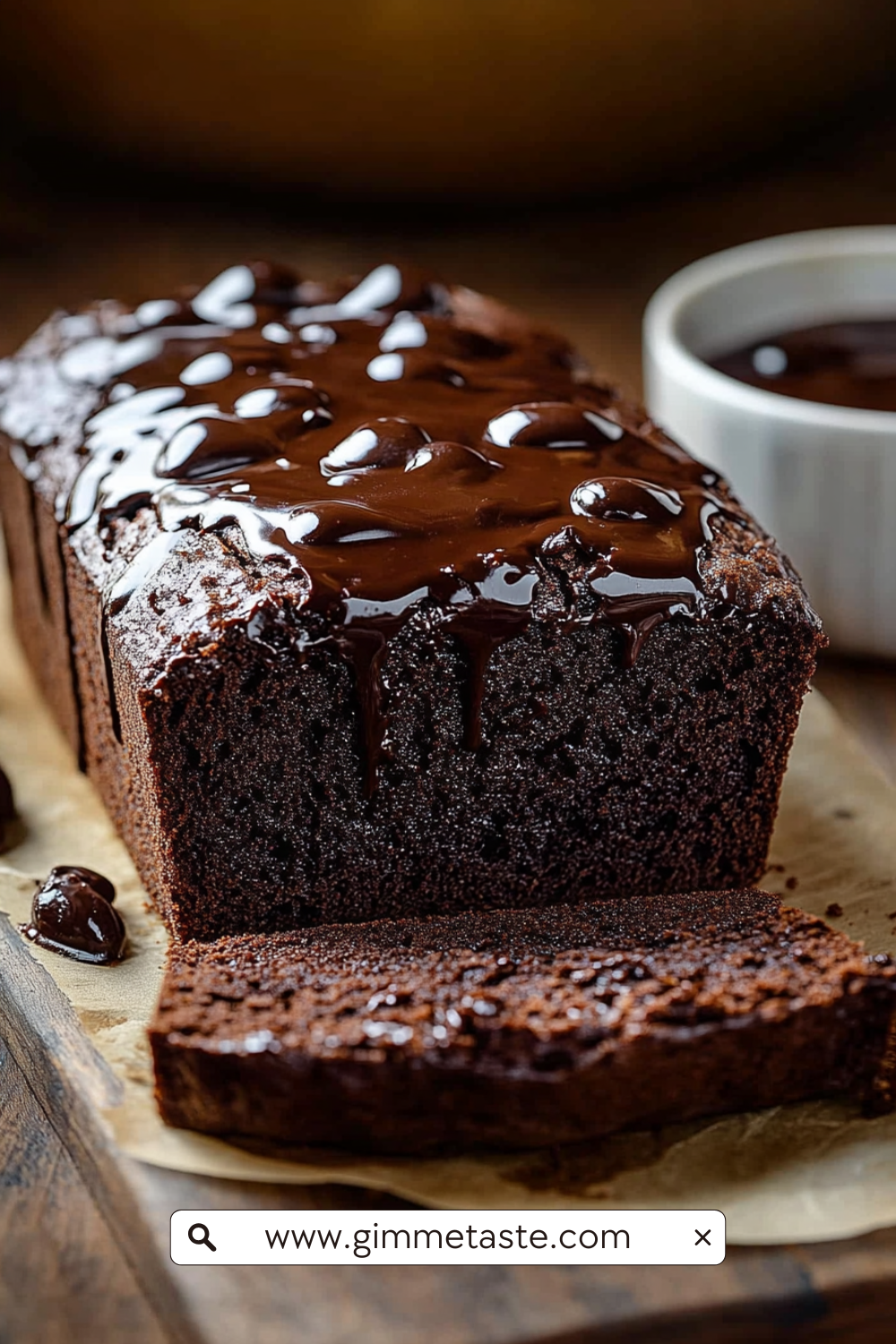Hot Fudge Brownie Bread with glossy milk chocolate ganache drizzle, rich and fudgy loaf on parchment paper.