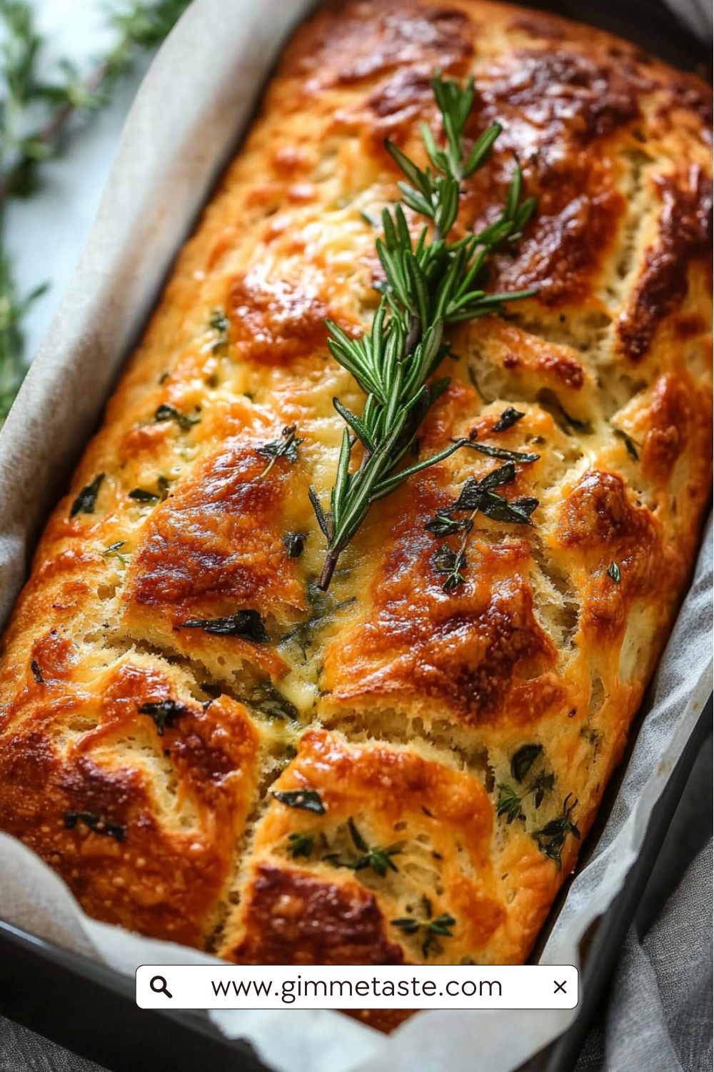 Cheese, Herb & Garlic Quick Bread (No Yeast) with golden crust, scattered herbs, and a moist interior filled with pockets of cheese and fresh herbs.