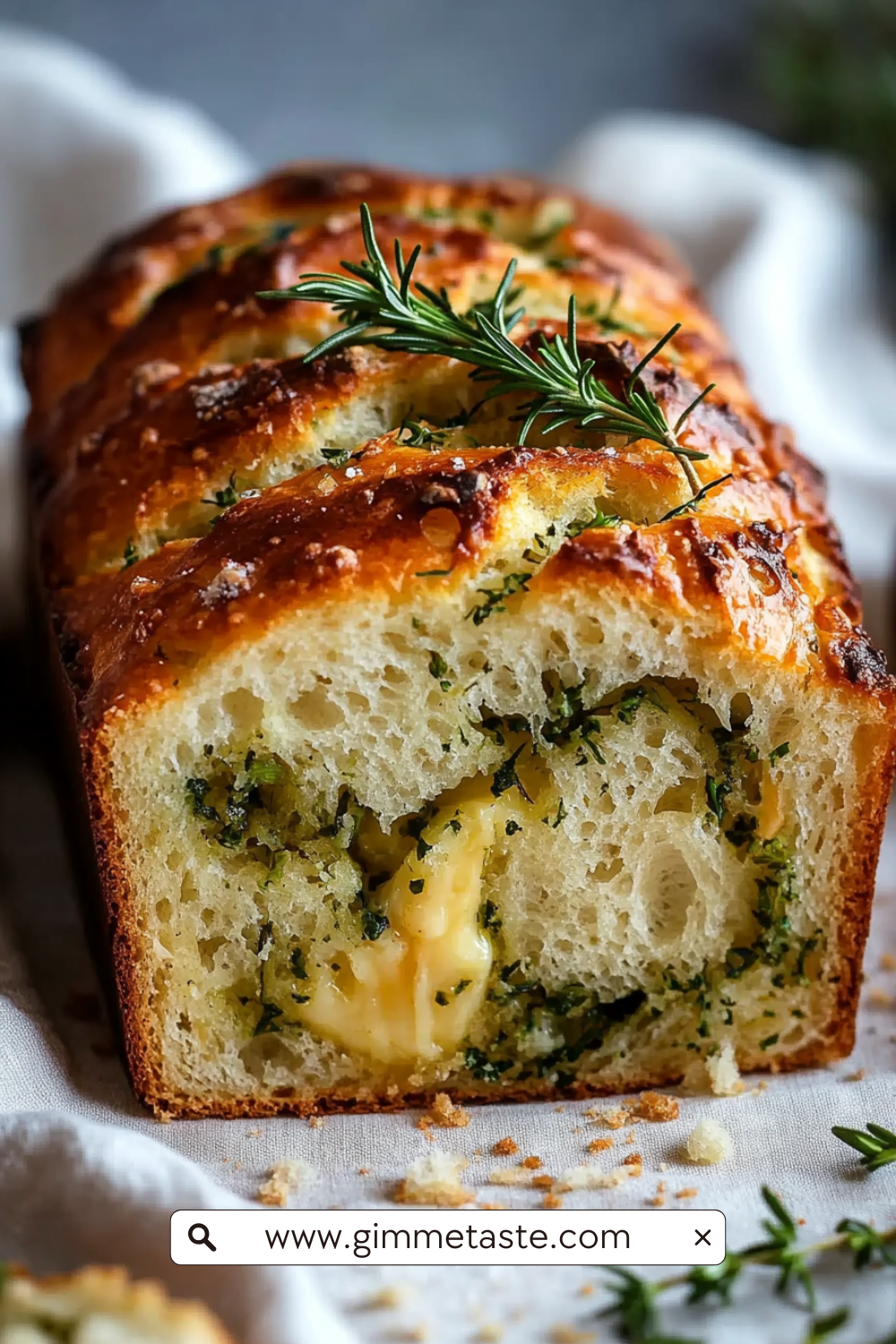 Cheese, Herb & Garlic Quick Bread (No Yeast) with golden crust, scattered herbs, and a moist interior filled with pockets of cheese and fresh herbs.