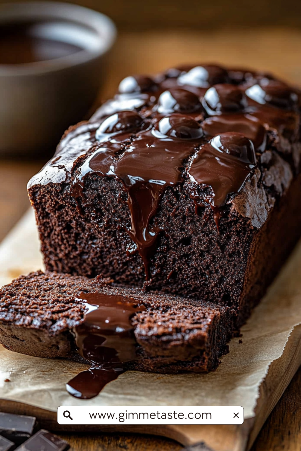 Hot Fudge Brownie Bread with glossy milk chocolate ganache drizzle, rich and fudgy loaf on parchment paper.