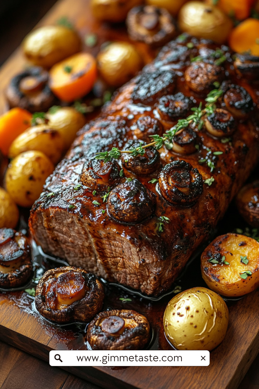 Slow Cooker Balsamic Glazed Pork Roast with golden honey glaze, rosemary sprigs, and roasted vegetables on a wooden cutting board.