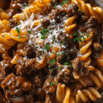 Delicious Garlic Beef Pasta served in a creamy garlic Parmesan sauce
