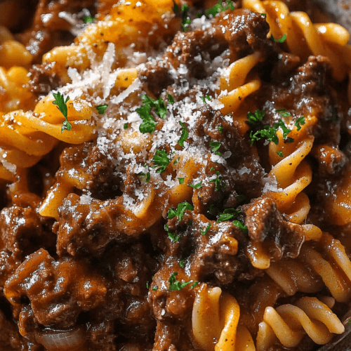 Delicious Garlic Beef Pasta served in a creamy garlic Parmesan sauce